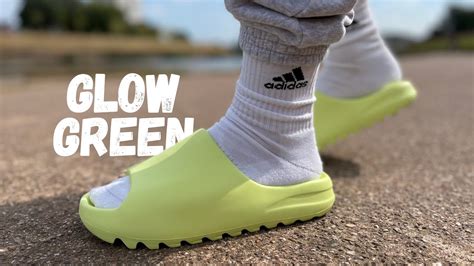 puke green yeezy slides.